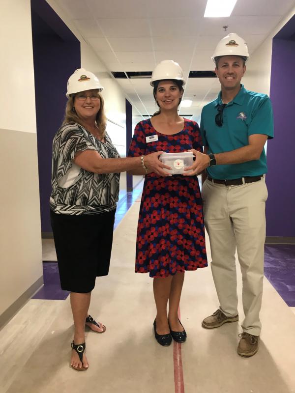 CEO Leah Stockton was given a tour of the Gerald Adams Elementary school currently under construction.  They plan to use the gift cards to furnish the new school.